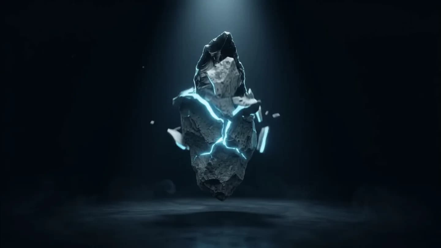 A rough grey stone under a cyan spotlight, cracking open with cyan light.